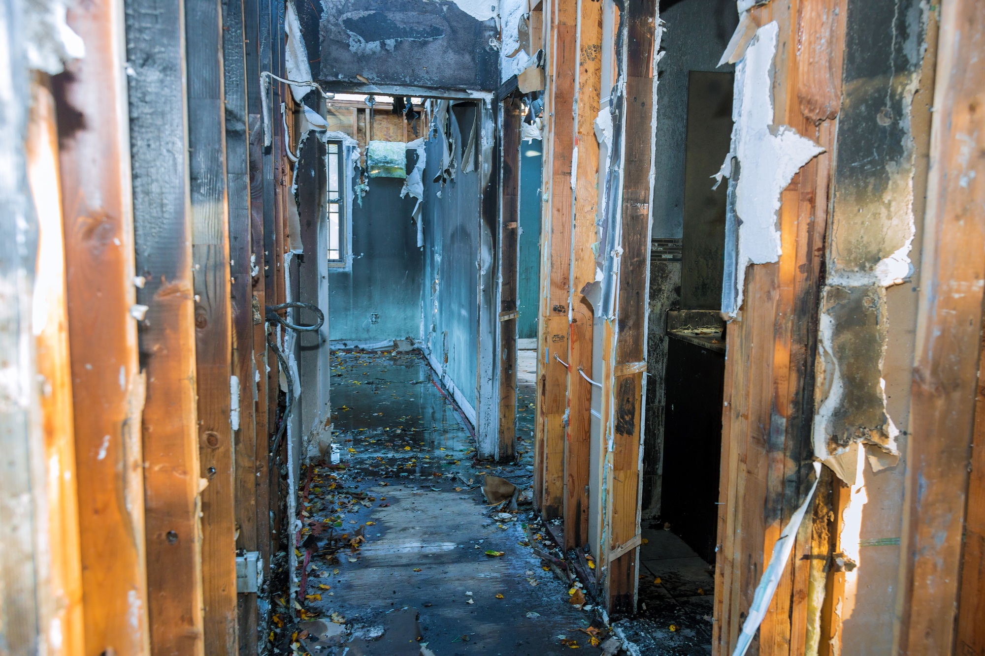 Completely burnt wooden house consequences of fire in California